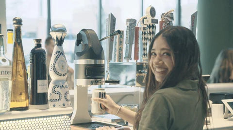 DT PRO at bar with woman using 